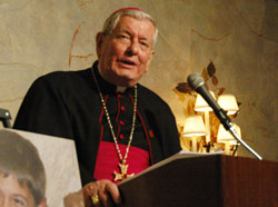 Archbishop Pietro Sambi, apostolic nuncio to the United States, speaks on May 3 at the Meridian Hills Country Club in Indianapolis during a fundraising dinner sponsored by the Franciscan Foundation for the Holy Land. The dinner supported the Franciscan Boys Home in Bethlehem. Photos of the home’s residents are displayed next to Archbishop Sambi. (Photo by Sean Gallagher)