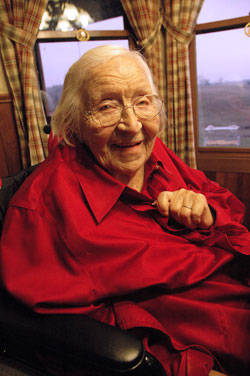 St. Charles Borromeo parishioner Emelie Weil of Milan celebrated her 110th birthday on Nov. 20, 2009. During 11 decades, she has acquired skills in nursing, playing the piano, painting, tatting and basket weaving. When she was complimented on a beautiful handmade basket on Jan. 17, Emelie smiled and replied, “Flatter me like that and it will go to my head.” (Photo by Mary Ann Wyand)