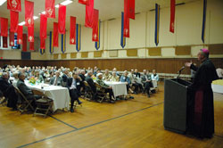 Bishop Christopher J. Coyne, right, auxiliary bishop and vicar general, speaks to members of the archdiocese’s Miter Society on May 4 at the Archbishop O’Meara Catholic Center in Indianapolis. (Photos by Sean Gallagher)