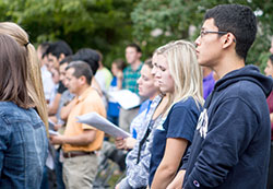 Young adults gather for Mass at the archbishop’s residence as part of the archdiocesan Young Adult and College Campus Ministry’s “Bishop’s Bash” event on Sept. 15, 2013. The event is a way for the archdiocese to reach out to young adult Catholics to stem the tide of 75-80 percent of college students falling away from the faith. The ministry is supported by funds from the annual United Catholic Appeal. (Submitted photo)