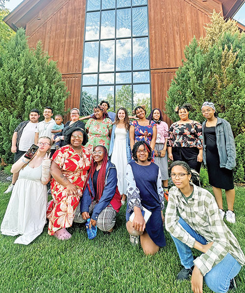 During a recent weekend retreat at the archdiocese’s Catholic Youth Organization’s Camp Rancho Framasa in Brown County, the group from Vagabond Missions in Indianapolis also participated in a Saturday evening Mass at St. Agnes Church in Nashville. Here, the group poses for a photo outside the church. (Submitted photo)