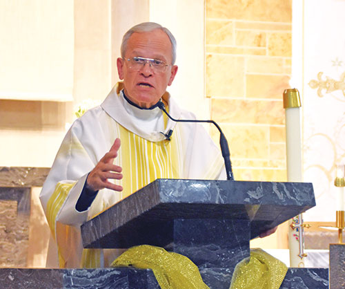 Msgr. Peter Vaccari, president of the New York-based Catholic Near East Welfare Association (CNEWA) and ex-officio chair of the board of trustees for the Pontifical Mission for Palestine, CNEWA’s aid organization in the Middle East, preaches a homily on May 4 at St. Michael the Archangel Church in Indianapolis. (Photo by Natalie Hoefer)