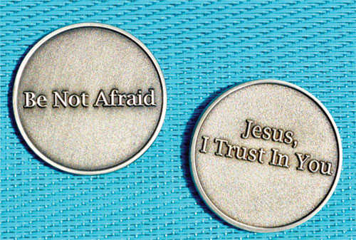 The two-fold message of the front side and the back side of a coin is one that has been shared with friends and strangers alike by Pat Maher, a member of SS. Peter and Paul Cathedral Parish of Indianapolis. (Photo courtesy of Mary Shaughnessy)