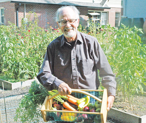 A member of St. Thomas Aquinas Parish in Indianapolis, Bill Scott has turned his north side Indianapolis backyard into a bountiful garden, sharing its harvest of vegetables with people in need at the nearby Boulevard Place Food Pantry. (Photo by John Shaughnessy)