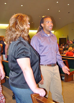 Justin Carter, a new teacher at Corpus Christi School, Evansville, shares his thoughts during a break at the annual Back to School gathering at Holy Redeemer School in Evansville. “He will be teaching grades kindergarten through eight music,” said Martha Craig, principal. (Message photo by Mary Ann Hughes)