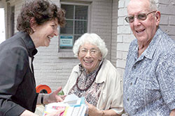 Dr. Mary Ludwig, center, and her husband, Paul, attend an open house at the Crawfordsville clinic named in her honor. (Photo provided)